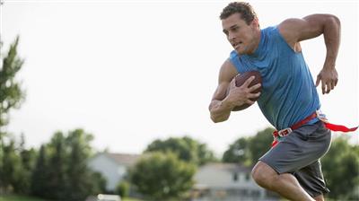 Man playing flag football 